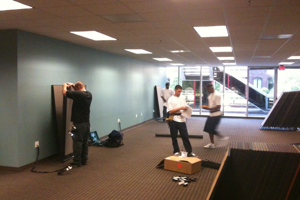 Office furniture being removed during a commercial cleanout
